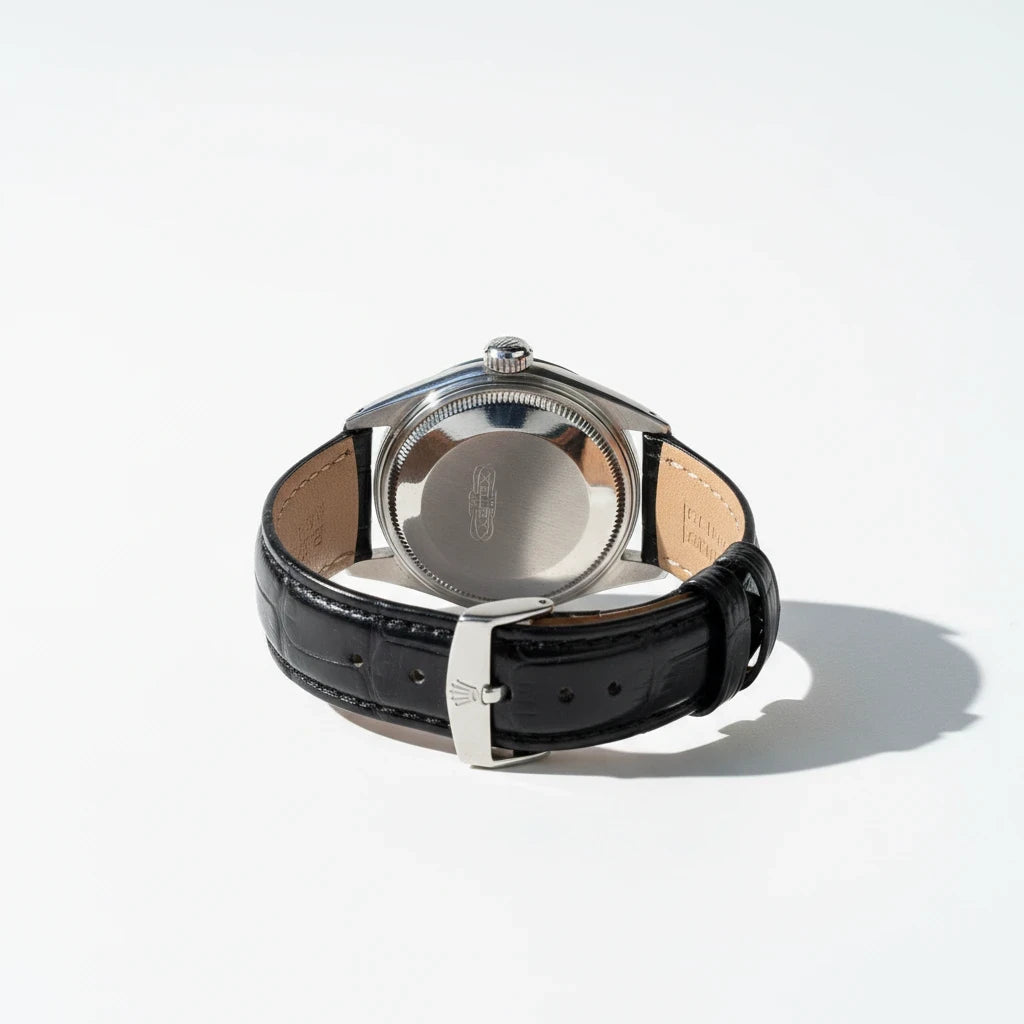 tokyopieces.com vintage Rolex Oysterdate Precision watch showing the stainless steel case back and black leather strap.