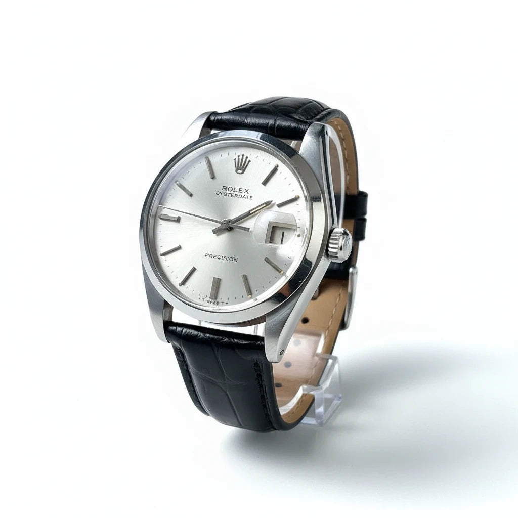 tokyopieces.com vintage Rolex Oysterdate Precision watch with a silver sunburst dial and black leather strap.