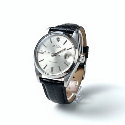tokyopieces.com vintage Rolex Oysterdate Precision watch with a silver sunburst dial and black leather strap.