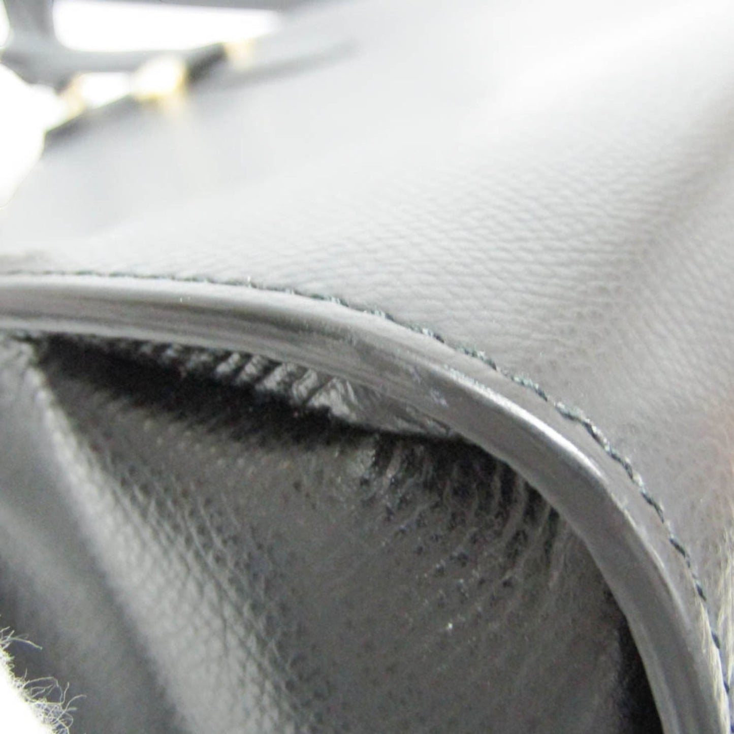 tokyopieces.com pre-owned Salvatore Ferragamo Today black leather tote bag with detailed stitching and smooth texture