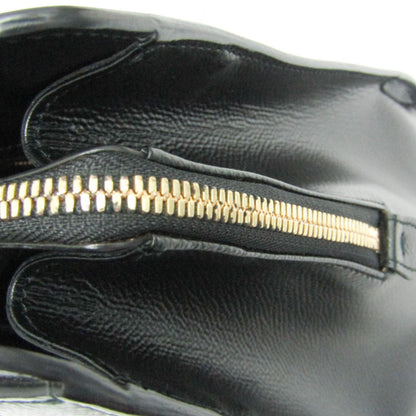 Close-up of the gold-tone zipper detail on a black leather Salvatore Ferragamo Today tote bag from tokyopieces.com.