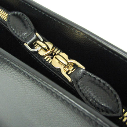 Close-up of the gold-tone zipper on a black leather Salvatore Ferragamo Today tote bag from tokyopieces.com.