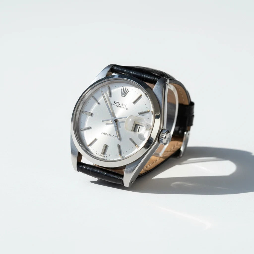 tokyopieces.com vintage Rolex Oysterdate Precision watch with a silver sunburst dial and black leather strap