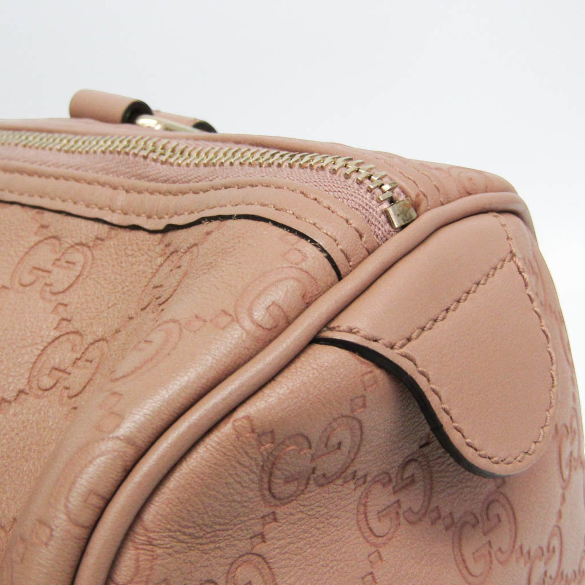 tokyopieces.com Gucci Guccissima blush pink leather Boston bag with embossed monogram and zip closure.
