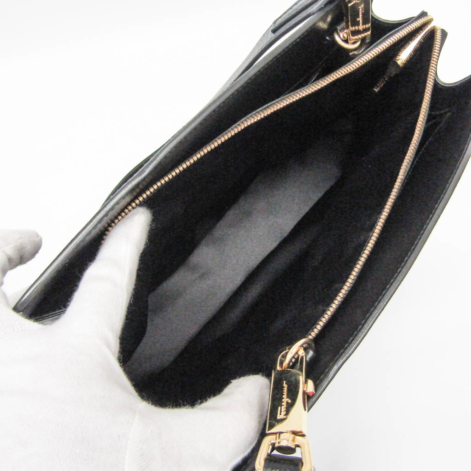 Interior of a black leather Salvatore Ferragamo Today tote bag with gold hardware, sold by tokyopieces.com