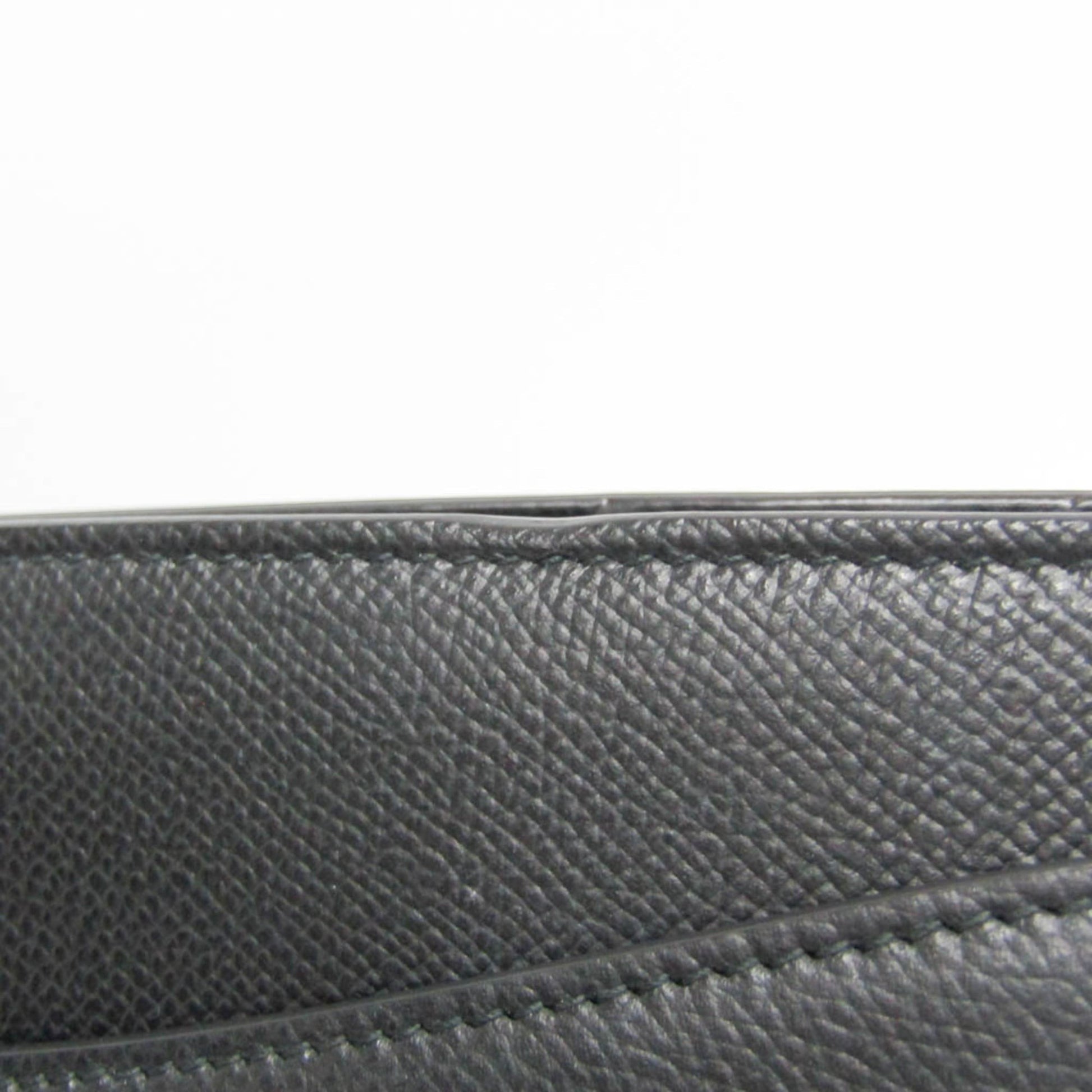 Close-up of black textured leather on a tokyopieces.com Salvatore Ferragamo Today tote bag showing fine stitching.